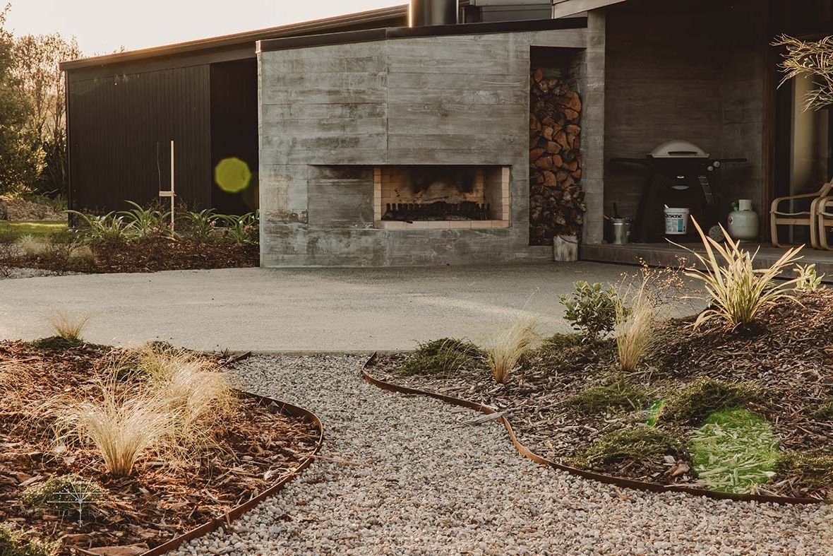 Backyard paved with permeable paving around a seating area