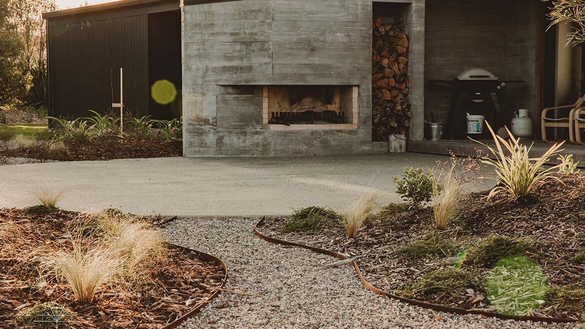 Backyard paved with permeable paving around a seating area