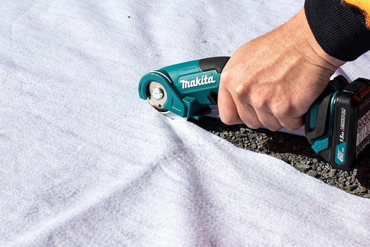 Cutting geotextile fabric