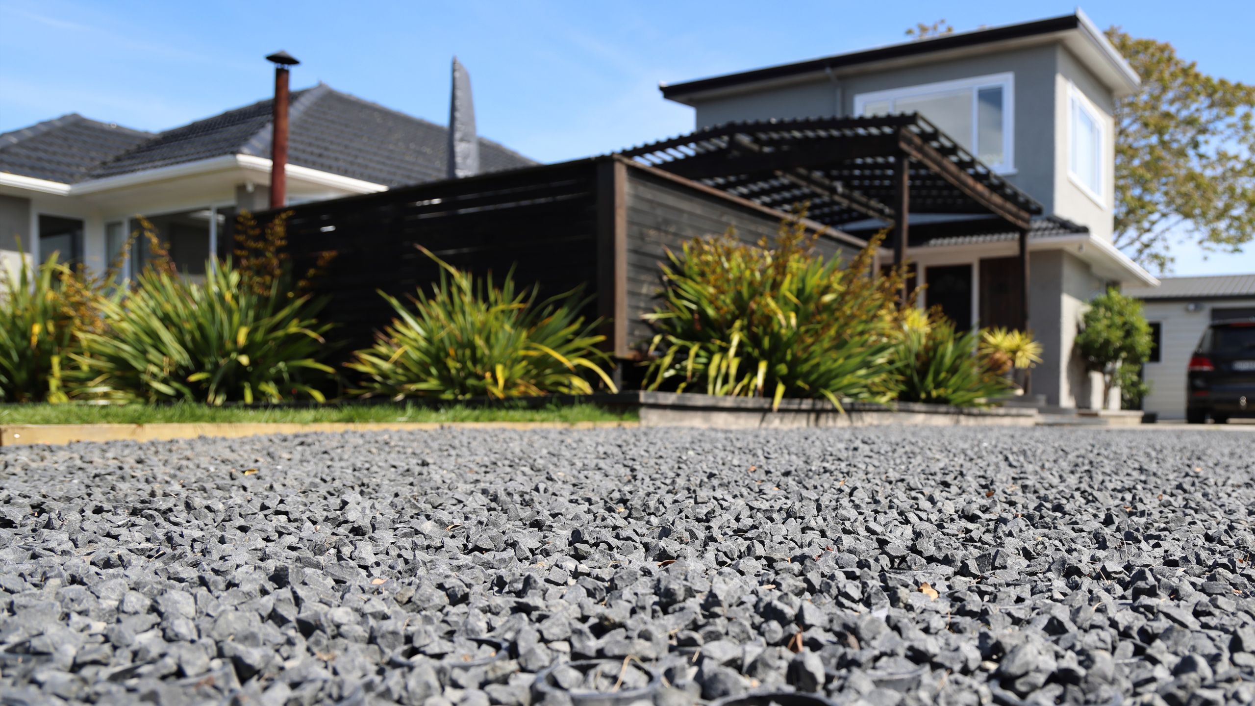 Permeable paved driveway leading to a home