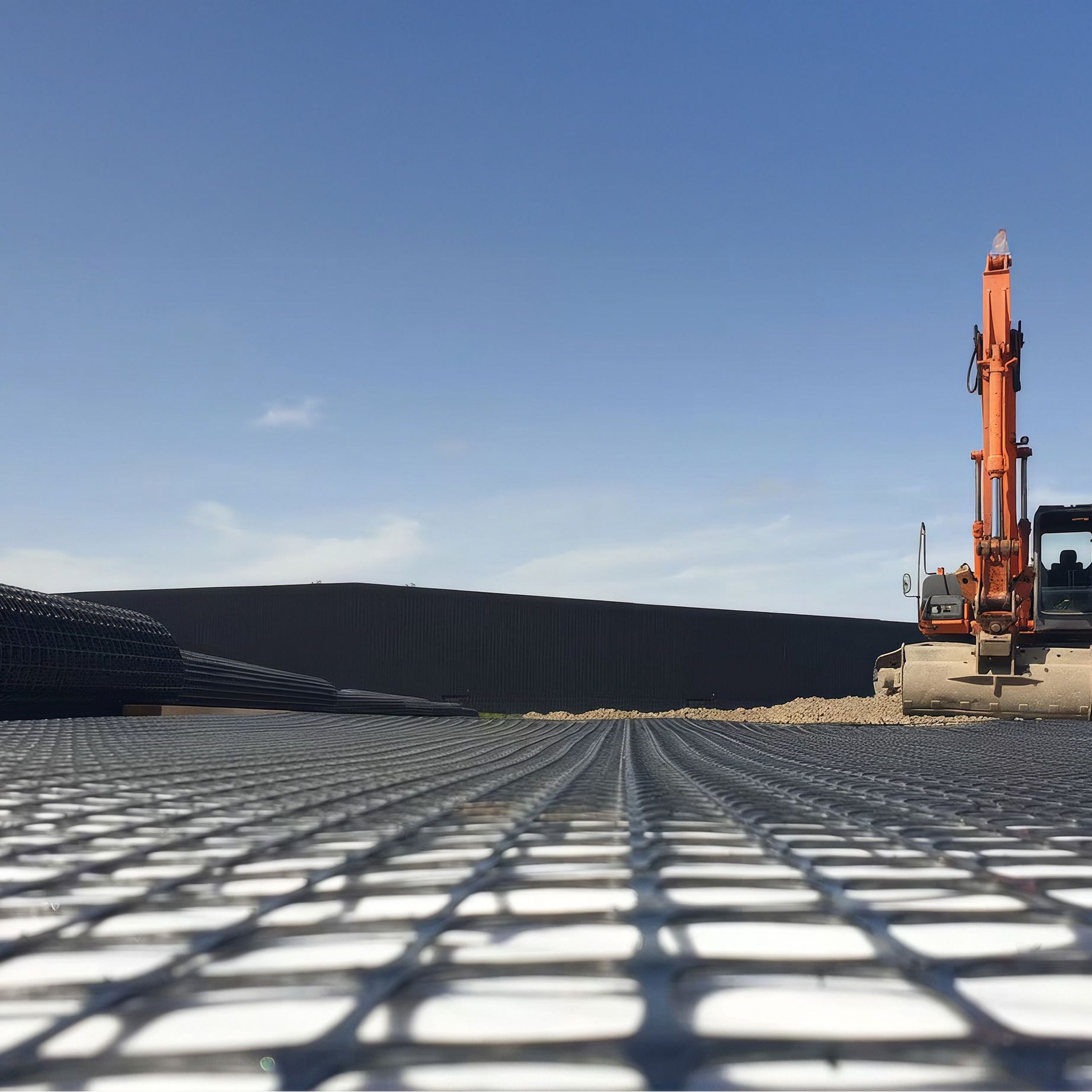 Geotextile and drainage layers beneath a finished surface