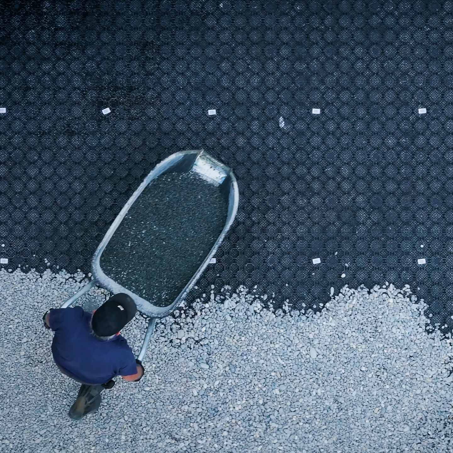 PebbleLock panels being installed on a prepared base
