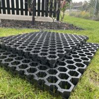 Stacked SureSoak drainage cells on a lawn