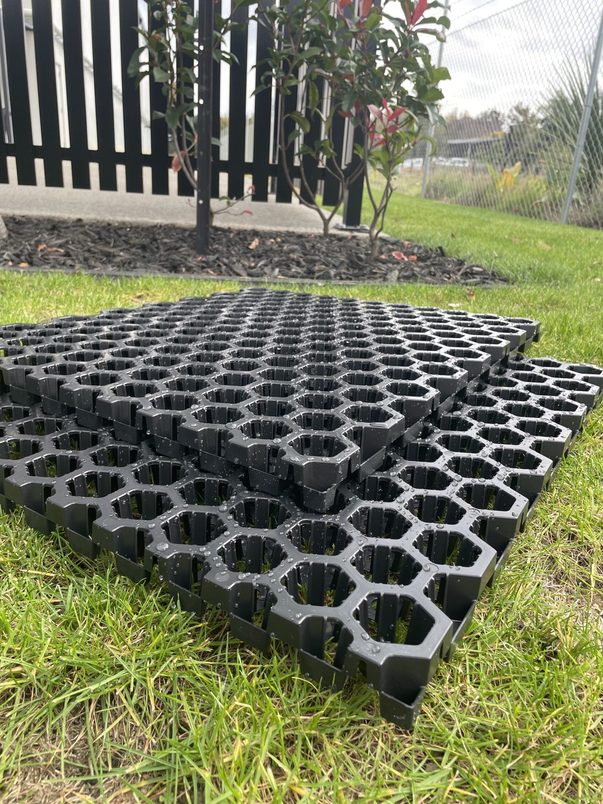 Stacked SureSoak drainage cells on a lawn