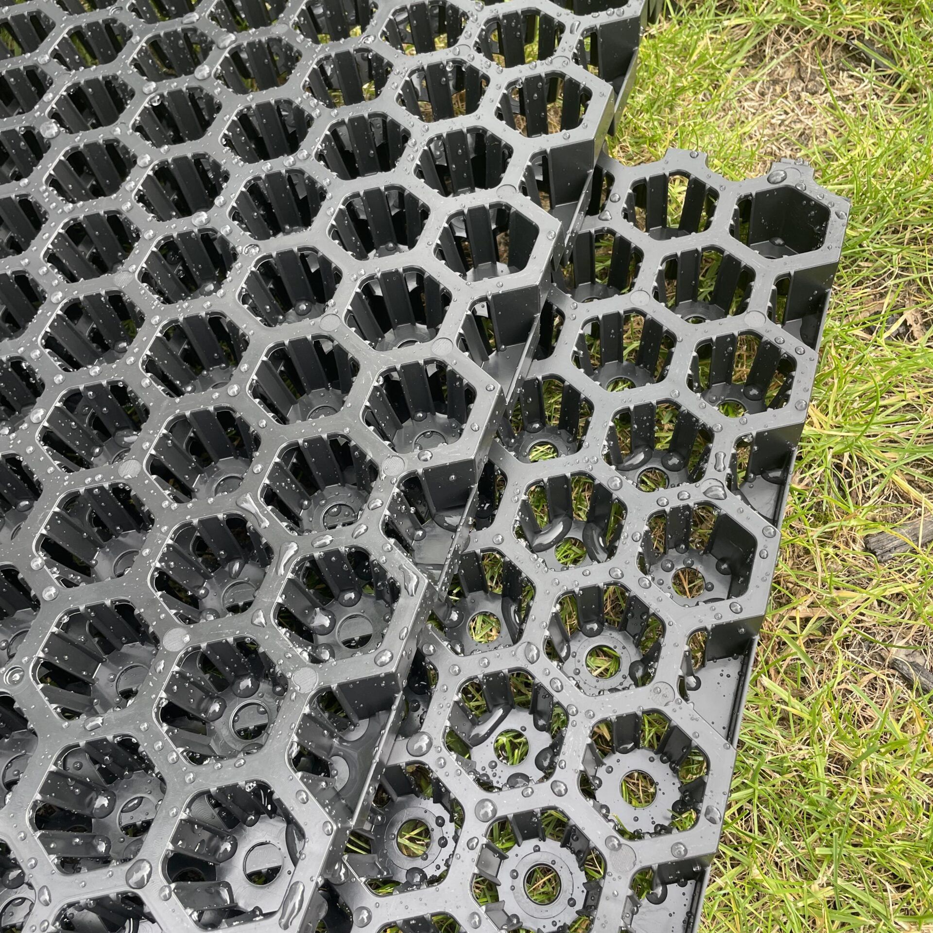 Close-up of SureSoak drainage cell panels on grass