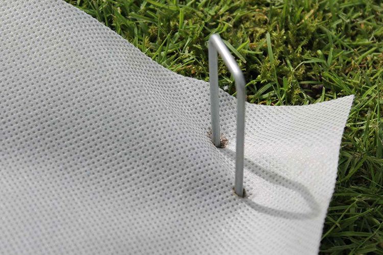 Staples pinning SmartMat Enviro weed mat