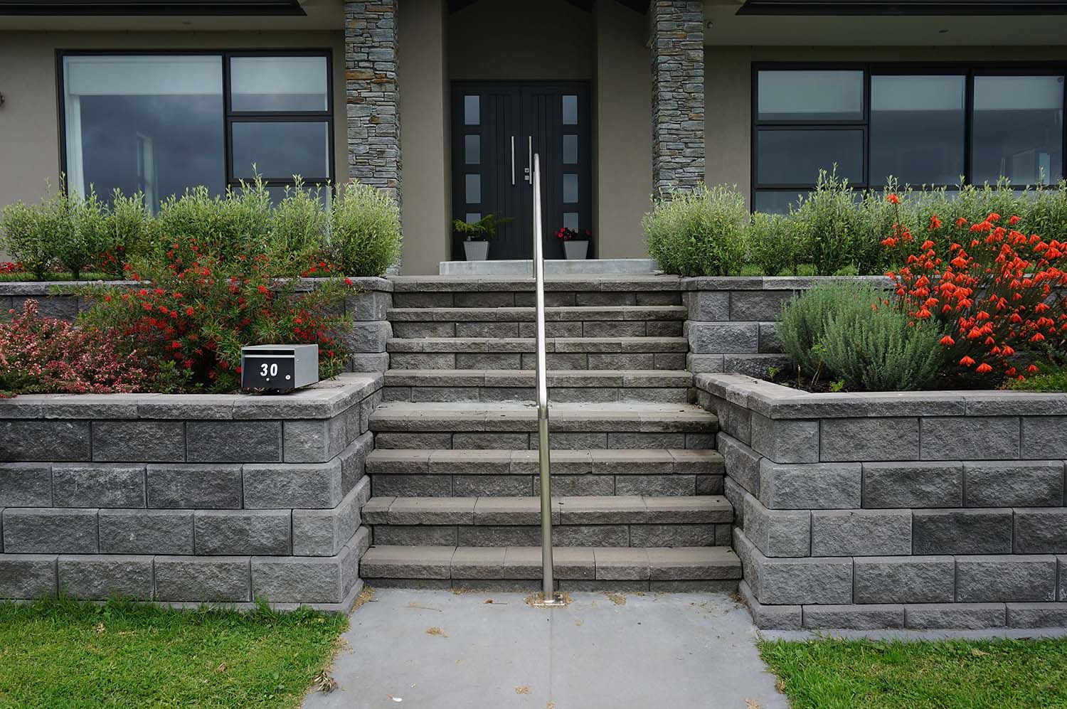 StrataGrid installed behind a home retaining wall