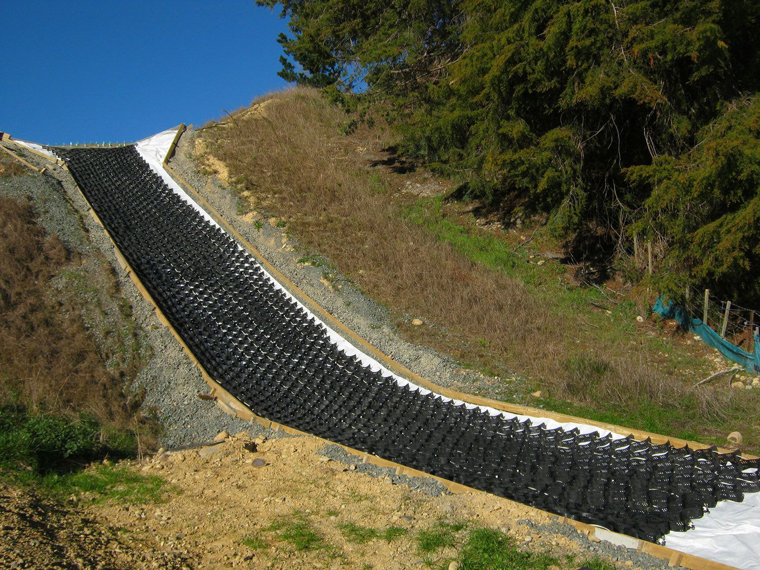 StrataWeb geocell filled on an embankment